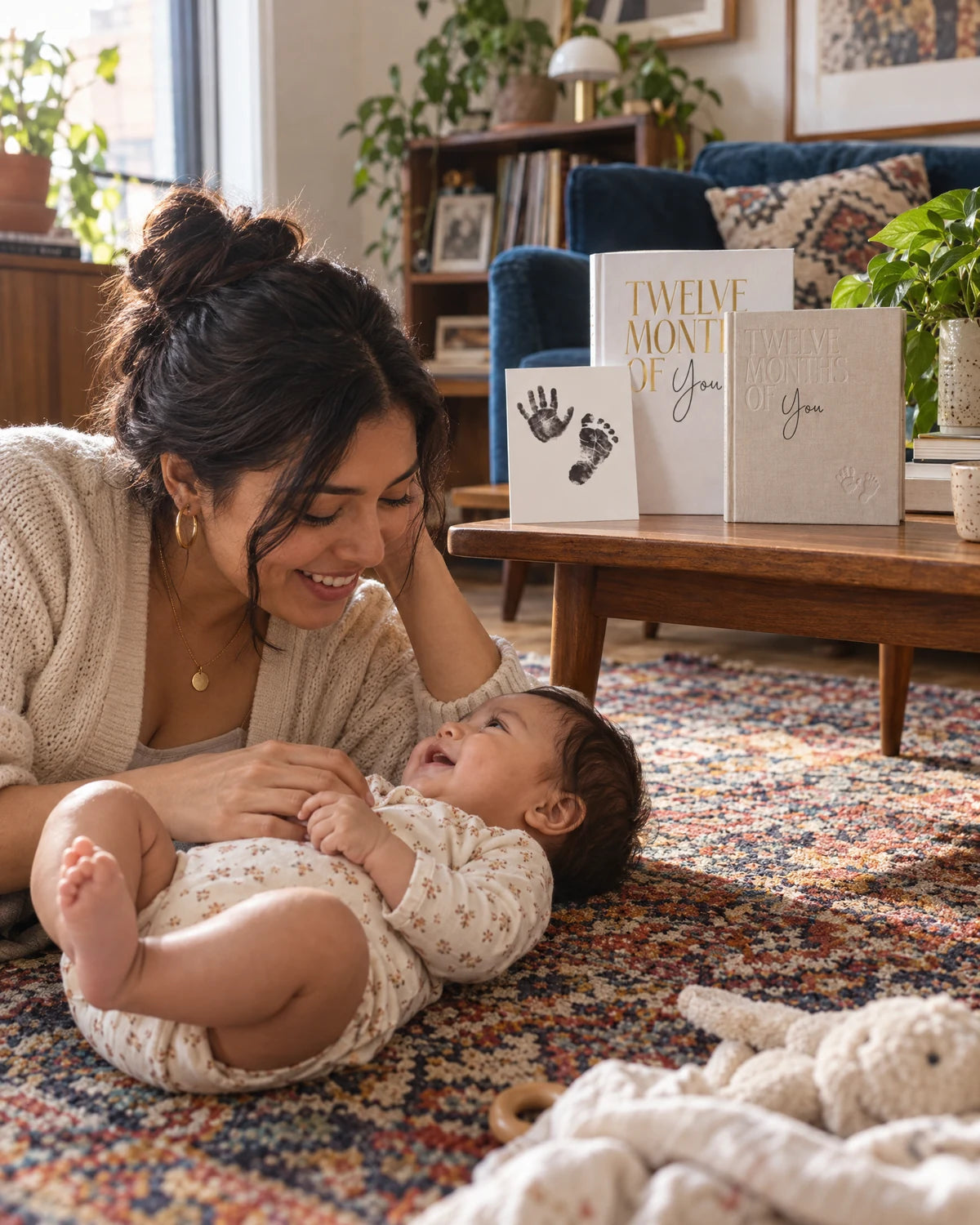 Mother and baby beside MinkTale keepsakes in a colorful living room
